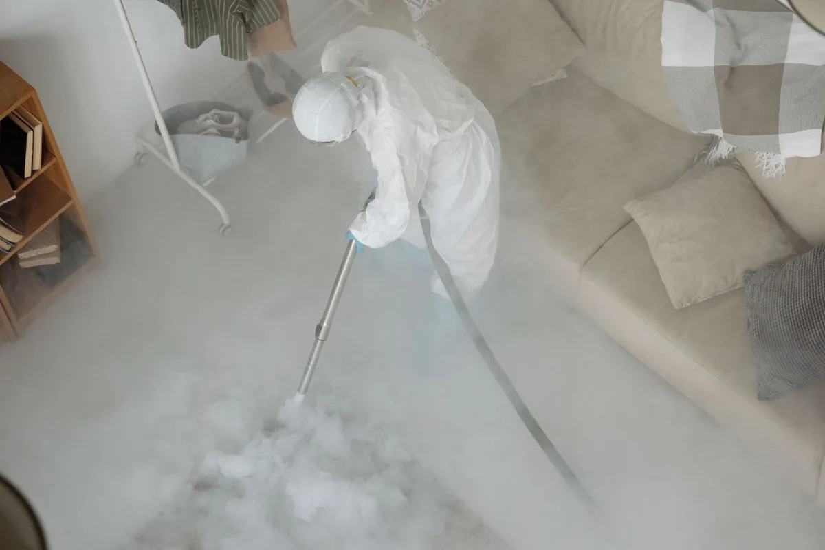 Biohazard cleanup technician in protective equipment, Orinda, CA